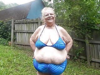 in blue swimsuit 