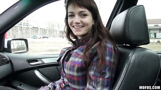 Brunette Aimee gets undressed in the car
