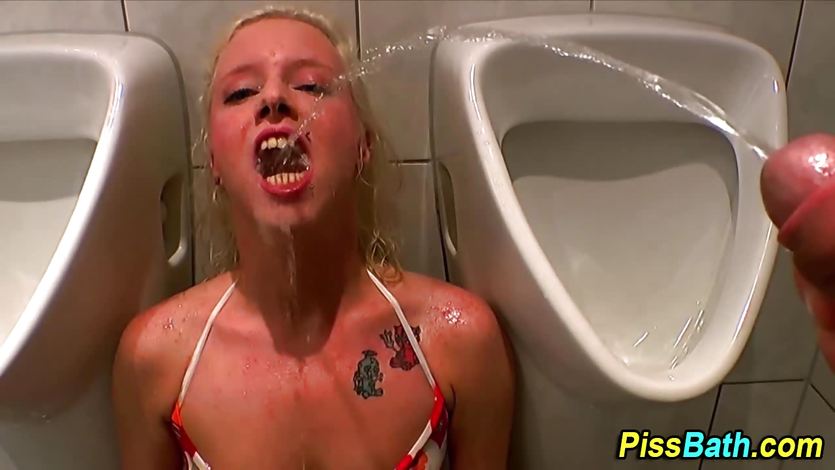 Piss slut drinks warm pee in urinal | PornTube ®
